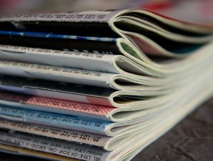 A stack of several magazines.
