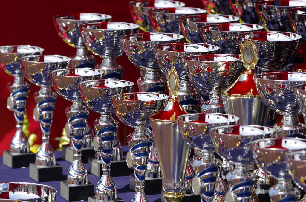 Several rows of silver trophies.