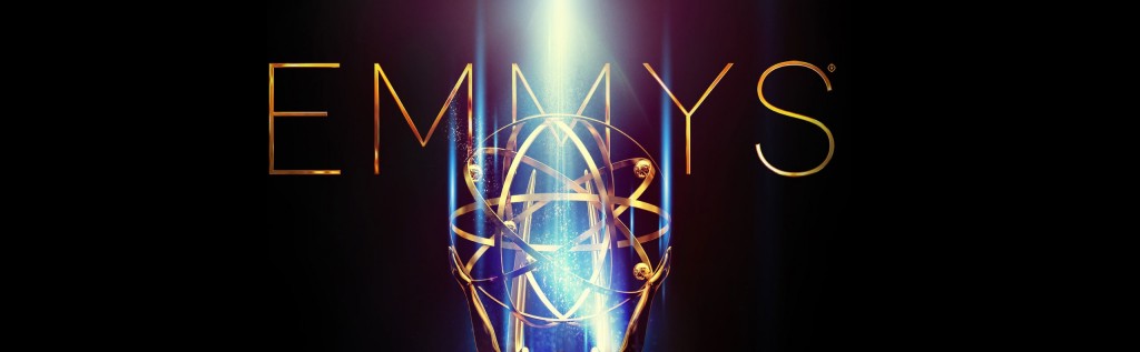 The word Emmys in gold, with the told of the award statue in front of it.