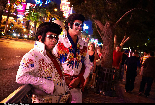 2 mean dressed as Elvis on the streets of Las Vegas.