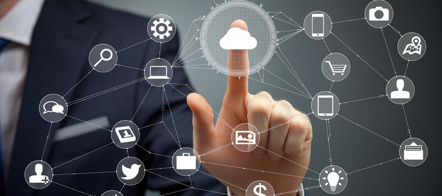 Man in a business suit touching a drawn cloud icon which connects in a web to other icons.