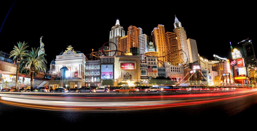 Las Vegas at night with cars going by in a blur.