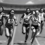 Women running a relay race.