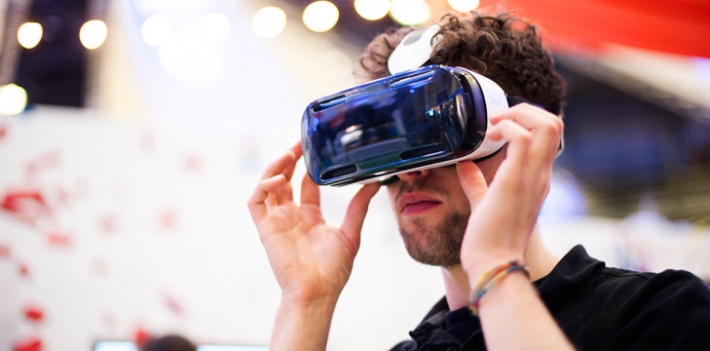 A man using a virtual reality headset.