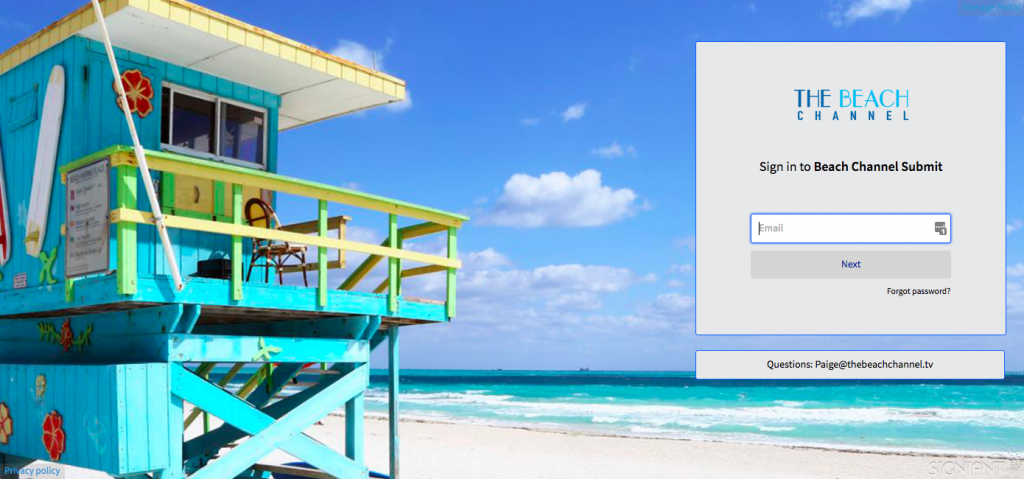 A bright blue, green and yellow surf shack on a beach.