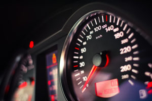A closeup of a speedometer in an Audi.