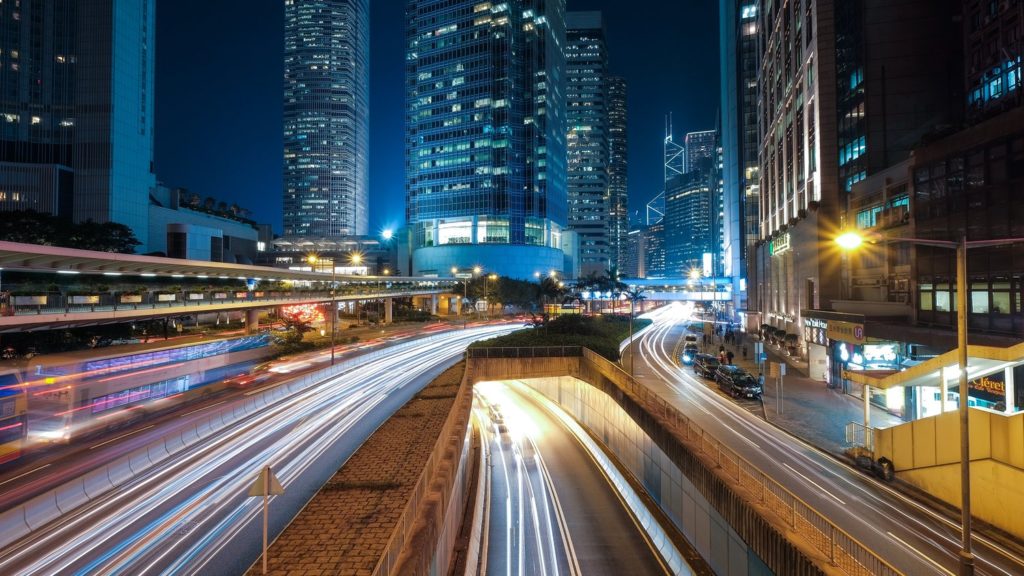 A time lapse of cars driving through a city.