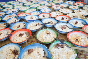 A large amount of bowls of rice and meat from a Hope Over Hurt outreach.