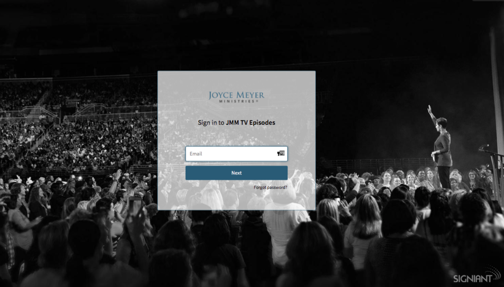 Joyce Media Shuttle Portal, women addressing a large audience background image
