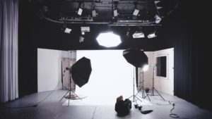 A studio set up to do photography with cameras, lights and other equipment.