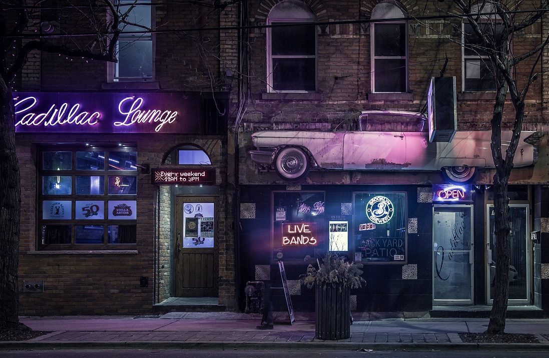 A bar called the Cadillac Lounge in a brick building.