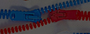 A red zipper and a blue zipper crossing each other.