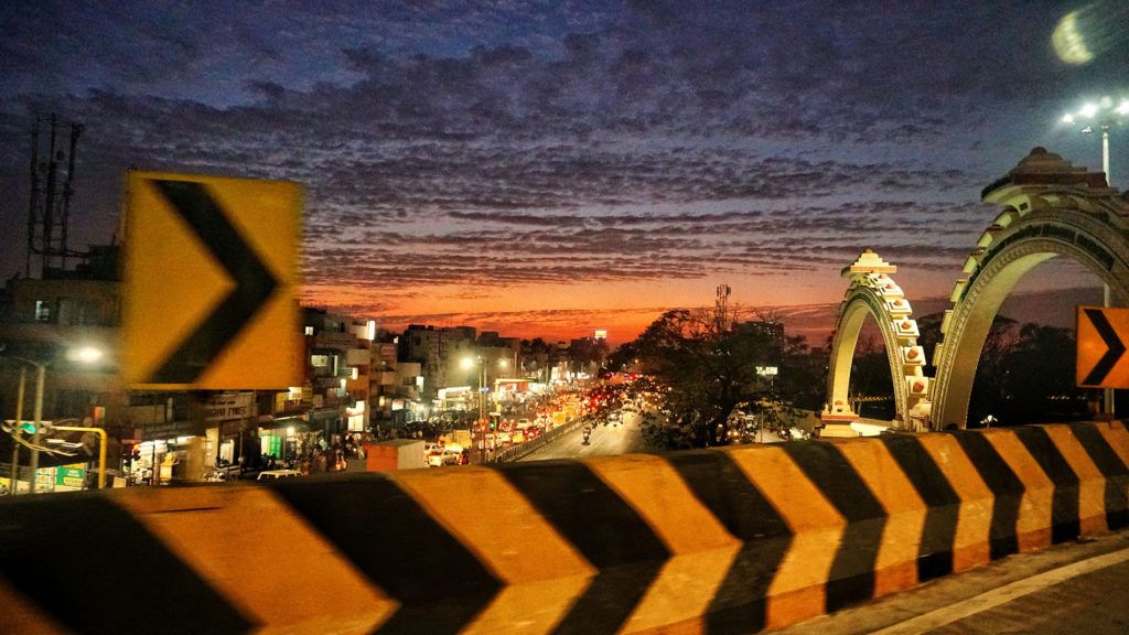 A busy street in Chennai, India at night.