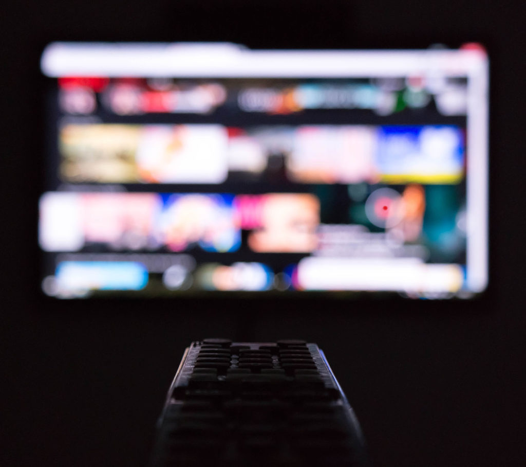 A remote pointing at a TV.