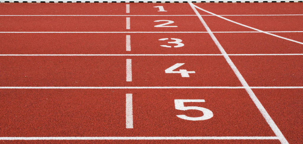 A red running track with numbers 1 through 5.