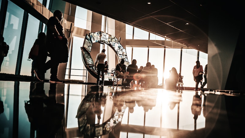 People in the lobby of a large office building.