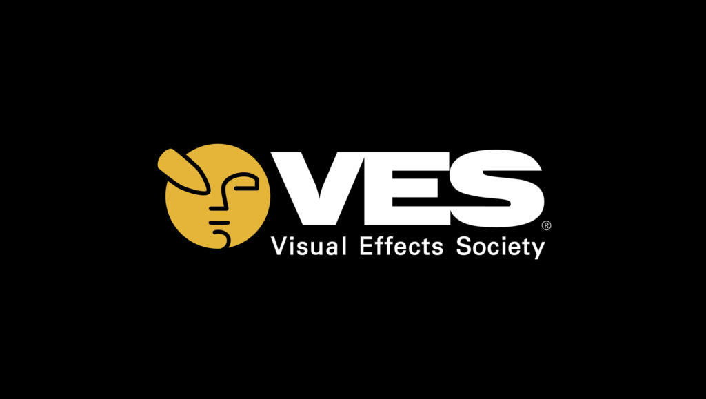 The letters V E and S in white next above the words visual effects society, and a yellow face with a pencil over one eye.