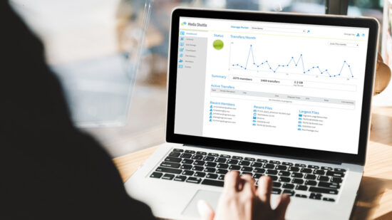 Laptop showing the transfers per month line graph on Media Shuttle